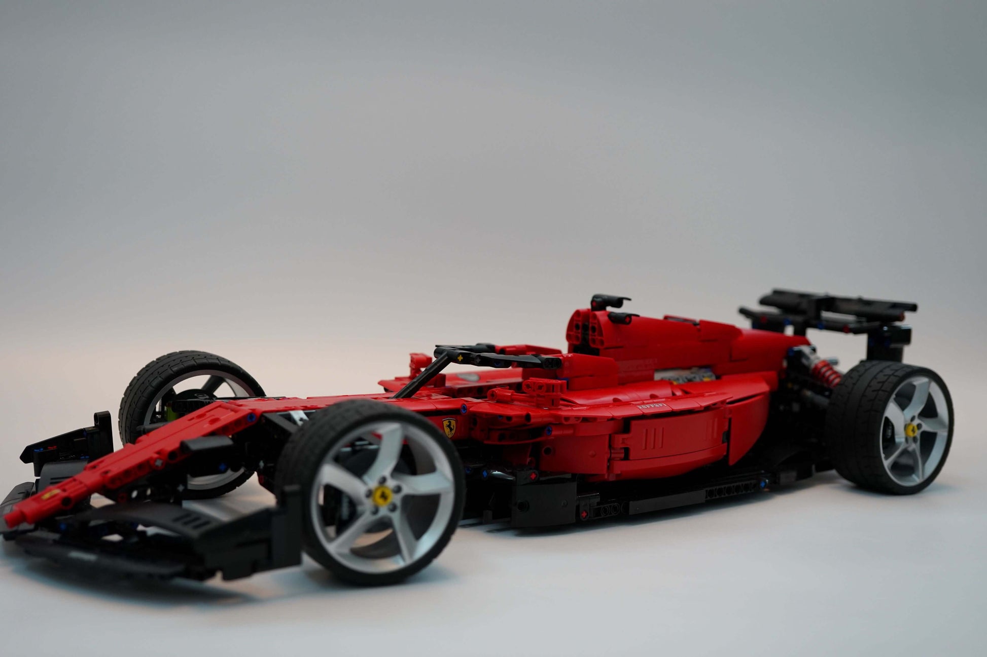 Alternative build instructions for LEGO Technic 42143:Transform your Ferrari Daytona SP3 kit into a F1 - WW Bricks Studio Official Store