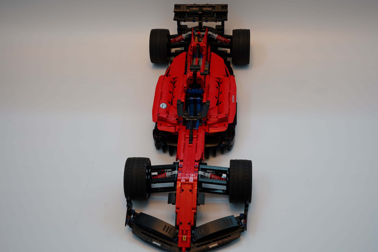 Alternative build instructions for LEGO Technic 42143：Transform your Ferrari Daytona SP3 kit into a F1 - WW Bricks Studio Official Store