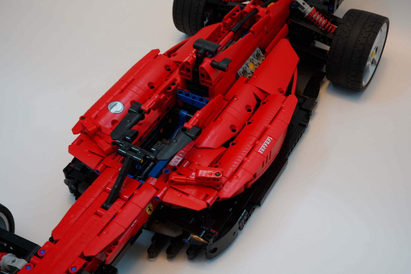 Alternative build instructions for LEGO Technic 42143：Transform your Ferrari Daytona SP3 kit into a F1 - WW Bricks Studio Official Store